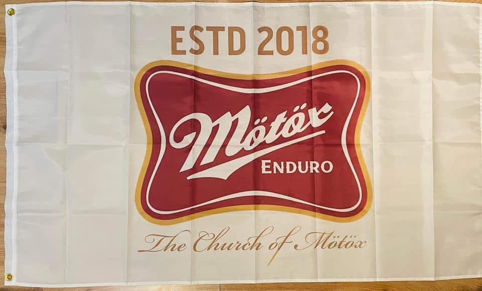 Cream and red Church of MÖTÖX Enduro flag established in 2018